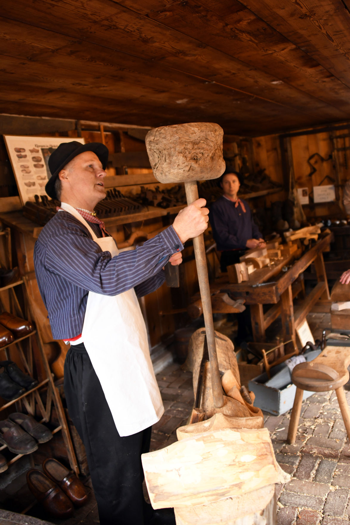 169 The wooden shoe maker shows his equipment.JPG